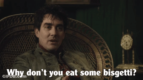 A Man Sitting In A Chair With The Words " Why Don T You Eat Some Bisgetti " GIF