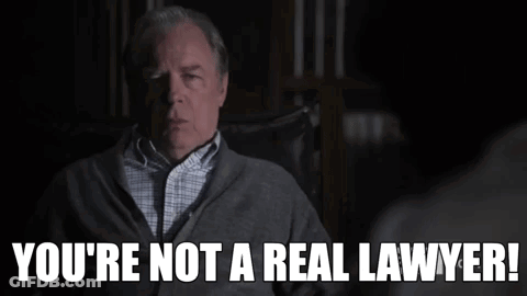 A Man Sitting In A Chair With The Words You 'Re Not A Real Lawyer GIF