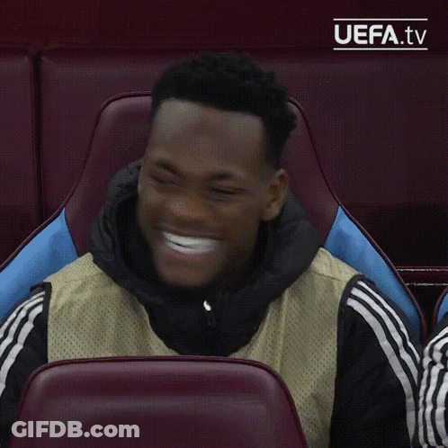 A Man Sitting In A Chair With Uefa.tv Written On The Bottom Right GIF