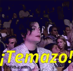 A Man Sitting In A Crowd With The Word Temazo On It GIF