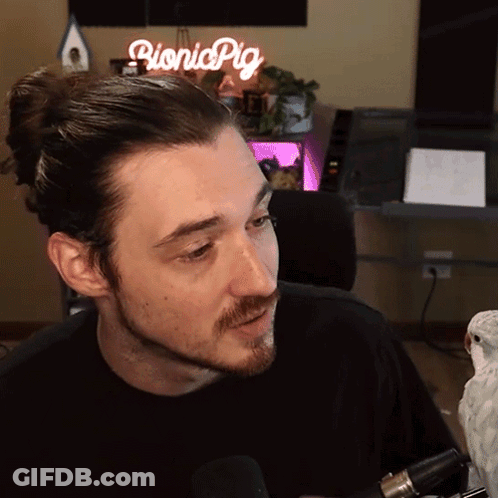 Man Sitting In Front Of Bionic Pig Sign GIF