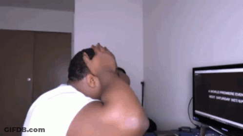 A Man Sitting In Front Of A Computer Screen That Says A World Premiere Event Next Saturday GIF