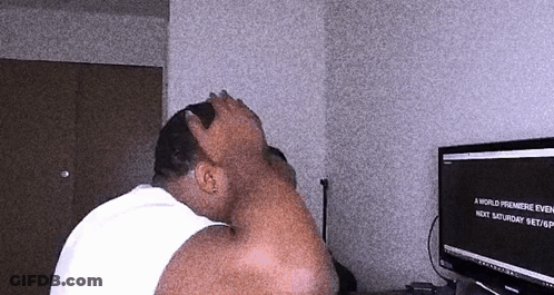 A Man Sitting In Front Of A Computer Screen That Says A World Premiere Event Next Saturday Sept GIF