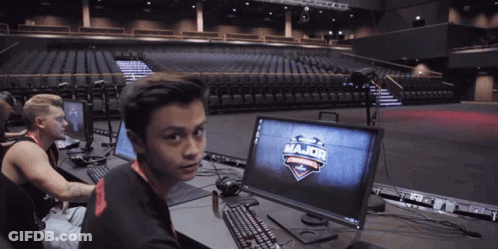 A Man Sitting In Front Of A Computer Screen That Says Major GIF