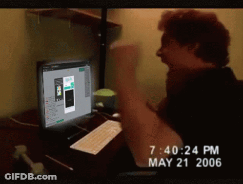 A Man Sitting In Front Of A Computer With The Time Of 7:40 Pm On May 21 2006 GIF