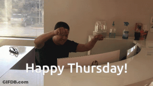A Man Sitting In Front Of A Computer With The Words Happy Thursday GIF