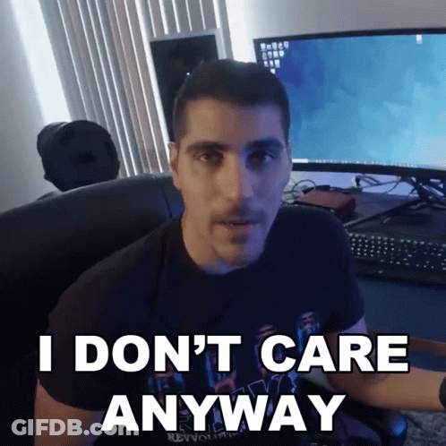 A Man Sitting In Front Of A Computer With The Words I Don 'T Care Anyway GIF