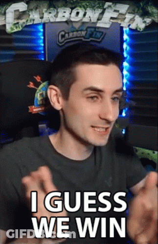 A Man Sitting In Front Of A Computer With The Words I Guess We Win On His Face GIF