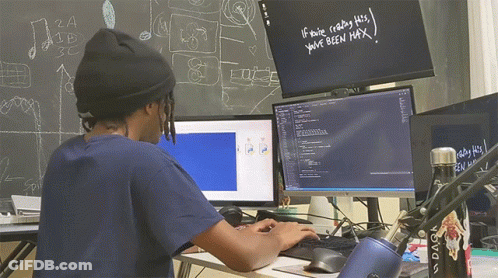 A Man Sitting In Front Of A Computer With The Words If You 'Re Reading This You 'Ve Been Max Written On A Blackboard GIF