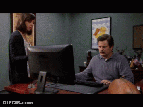 A Man Sitting In Front Of A Dell Computer Monitor GIF