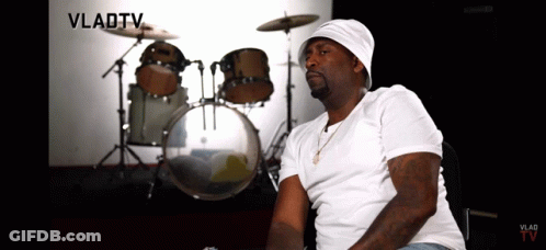 A Man Sitting In Front Of A Drum Set With Vladtv Written In The Corner GIF