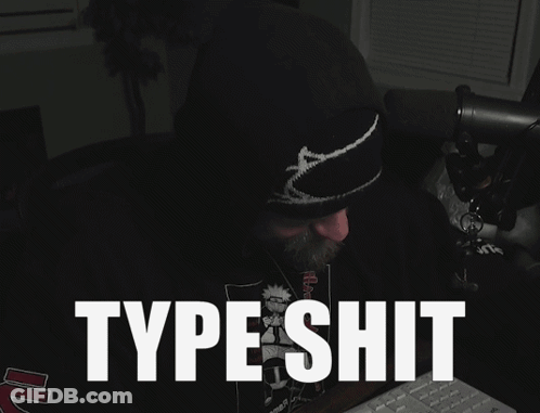A Man Sitting In Front Of A Keyboard With The Words Type Shit Written On The Screen GIF
