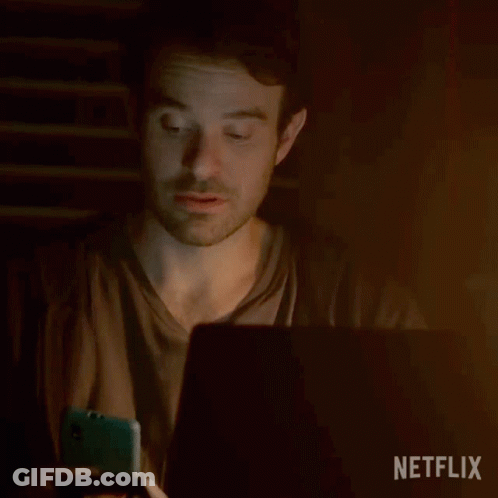 A Man Sitting In Front Of A Laptop With The Word Hey Written On The Screen GIF