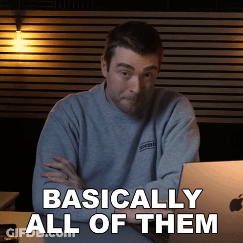 A Man Sitting In Front Of A Laptop With The Words Basically All Of Them Written Below Him GIF