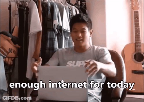A Man Sitting In Front Of A Laptop With The Words " Enough Internet For Today " On The Bottom GIF