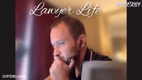 A Man Sitting In Front Of A Laptop With The Words " Lawyer Life " On The Bottom GIF