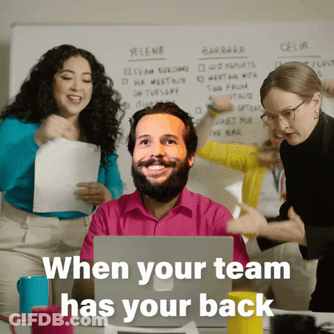 A Man Sitting In Front Of A Laptop With The Words " When Your Team Has Your Back " Written Below Him GIF