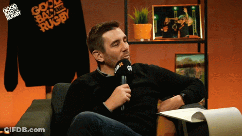 A Man Sitting In Front Of A Microphone That Says Gbr On It GIF