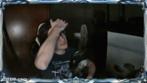 A Man Sitting In Front Of A Microphone With A Shirt That Says ' Emperor ' On It GIF