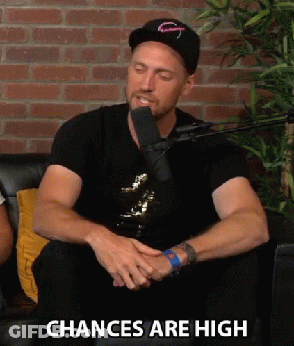 A Man Sitting In Front Of A Microphone With The Words " Chances Are High " Written Below Him GIF