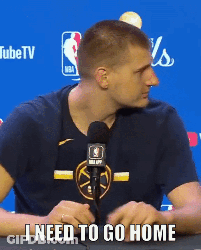 A Man Sitting In Front Of A Microphone With The Words I Need To Go Home GIF
