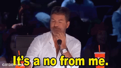 A Man Sitting In Front Of A Microphone With The Words It 'S A No From Me . GIF
