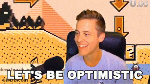 A Man Sitting In Front Of A Microphone With The Words Let 'S Be Optimistic GIF