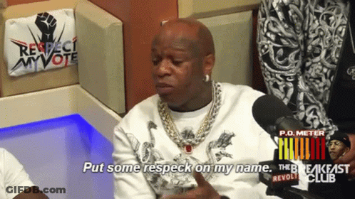 A Man Sitting In Front Of A Microphone With The Words Put Some Respect On My Name GIF