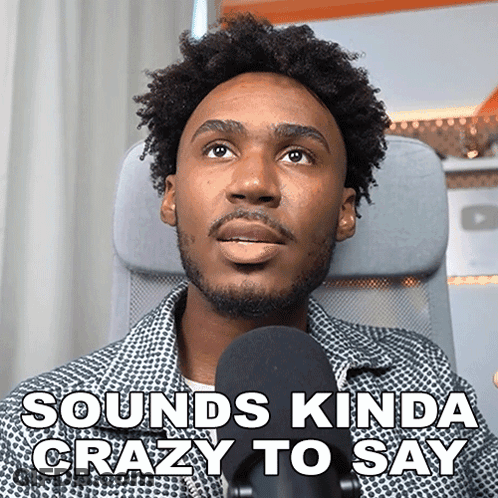 A Man Sitting In Front Of A Microphone With The Words " Sounds Kinda Crazy To Say " Above Him GIF