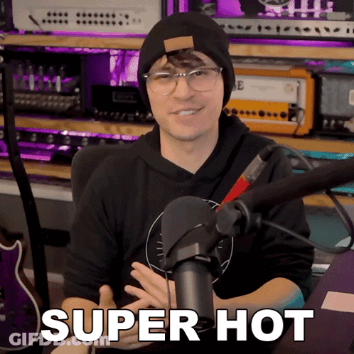 Man Sitting In Front Of Microphone With Super Hot Text GIF