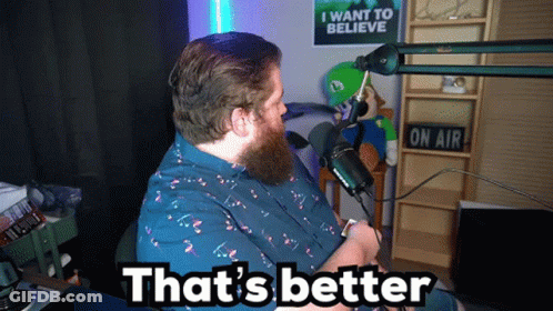 A Man Sitting In Front Of A Microphone With The Words That 'S Better On The Bottom GIF