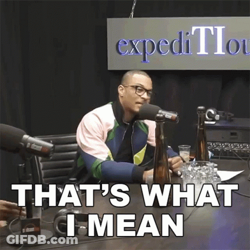 A Man Sitting In Front Of A Microphone With The Words That 'S What I Mean GIF