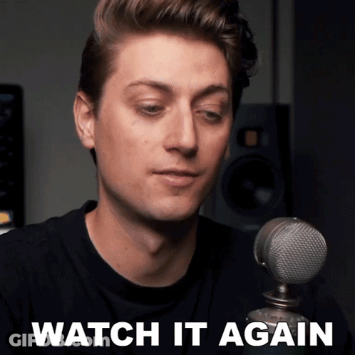 A Man Sitting In Front Of A Microphone With The Words Watch It Again On The Bottom GIF