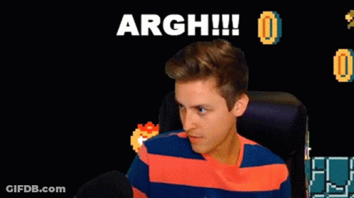 A Man Sitting In Front Of A Screen That Says Argh GIF