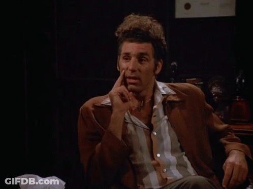 A Man Sitting In Front Of A Sign That Says That 'S True On It GIF