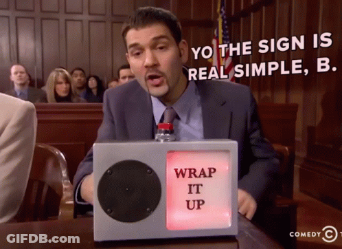 A Man Sitting In Front Of A Sign That Says " Wrap It Up " GIF