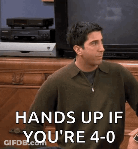 A Man Sitting In Front Of A Television With The Words Hands Up If You 'Re 4-0 GIF