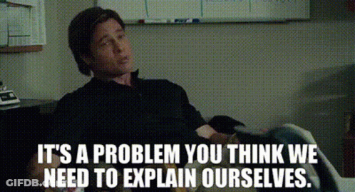A Man Sitting In Front Of A White Board With The Words It 'S A Problem You Think We Need To Explain Ourselves GIF