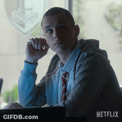 A Man Sitting In Front Of A Window With The Word Netflix On The Bottom GIF