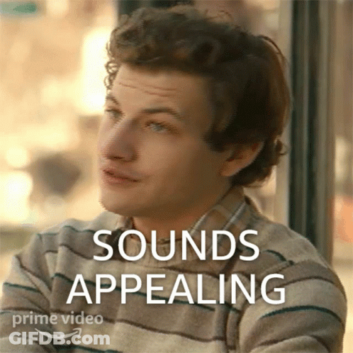 Man Sitting By Window Saying Sounds Appealing GIF