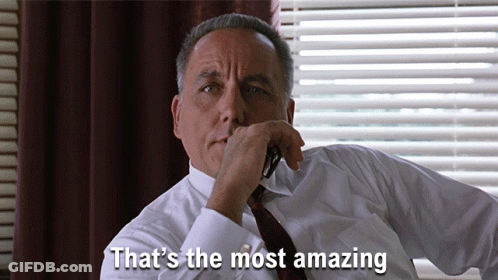 A Man Sitting In Front Of A Window With The Words That 'S The Most Amazing Above Him GIF