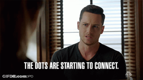 A Man Sitting In Front Of A Window With The Words " The Dots Are Starting To Connect " GIF