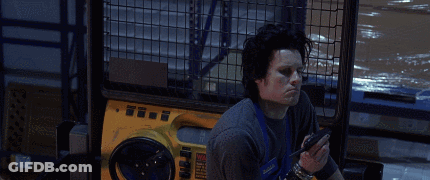 A Man Sitting In Front Of A Yellow Machine With The Words Well Paint Me Intrigued GIF