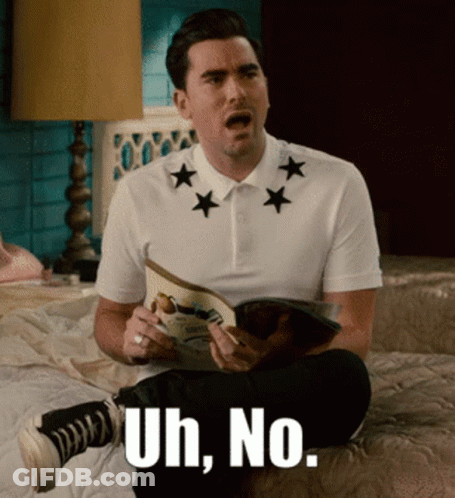 A Man Sitting On A Bed Reading A Magazine With The Words Uh No GIF