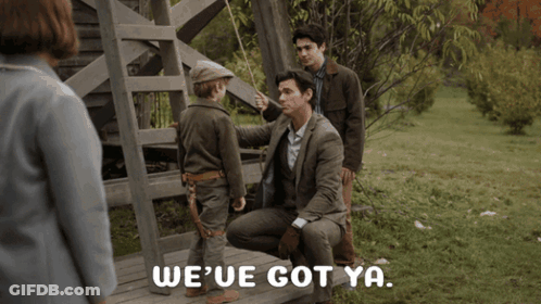 A Man Sitting On A Bench Talking To A Little Boy With The Words We 'Ve Got Ya Written On The Bottom GIF