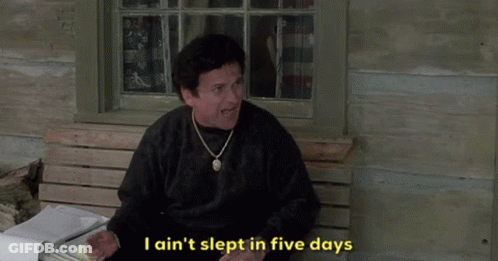 A Man Sitting On A Bench With The Words I Ain T Slept In Five Days Below Him GIF