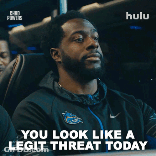 A Man Sitting On A Bus With The Words You Look Like A Legit Threat Today GIF