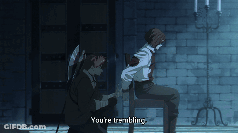 A Man Sitting On A Chair Talking To Another Man With The Words You 'Re Trembling Below Him GIF