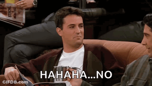 A Man Sitting On A Couch Laughing With The Words " Hahaha No " Written On The Bottom GIF