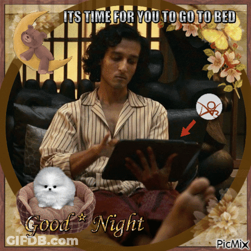 A Man Sitting On A Couch Using A Tablet With A Good Night Greeting GIF